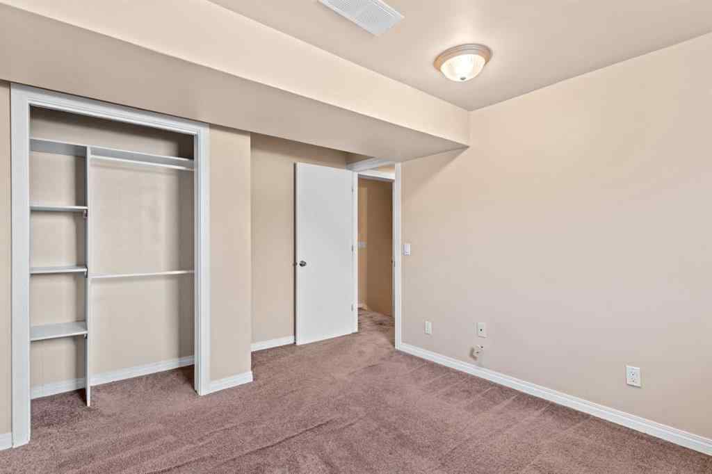 MLS® A2258825 - 212 Queen Anne Road SE in Queensland Calgary, Residential