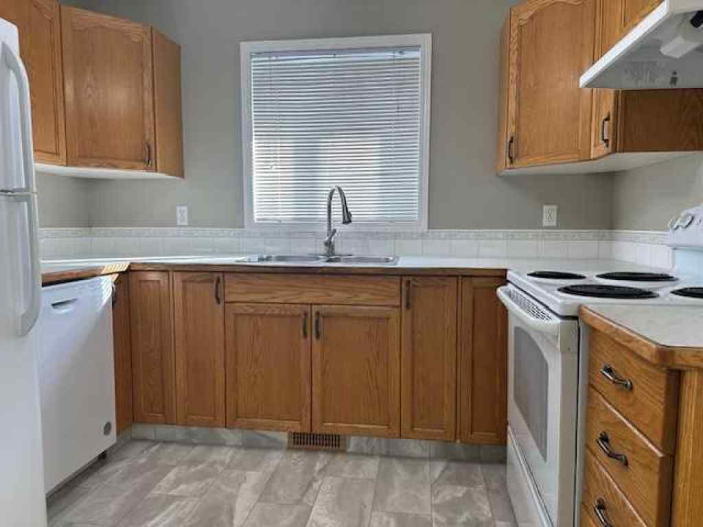 MLS® A2258891 - Unit #A 5913 52 Avenue  in Riverside Meadows Red Deer, Residential