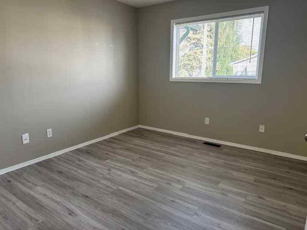MLS® A2258891 - Unit #A 5913 52 Avenue  in Riverside Meadows Red Deer, Residential