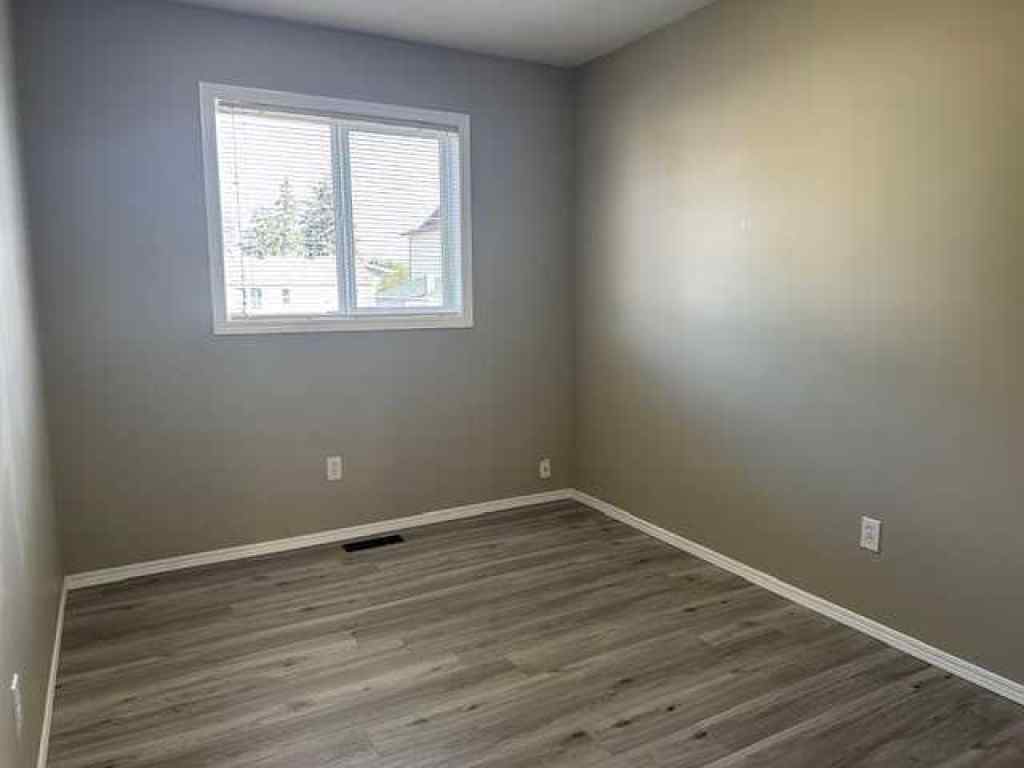 MLS® A2258891 - Unit #A 5913 52 Avenue  in Riverside Meadows Red Deer, Residential