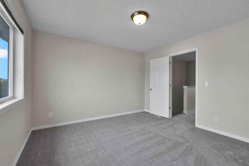 MLS® A2258916 - 203 Cranberry Green SE in Cranston Calgary, Residential