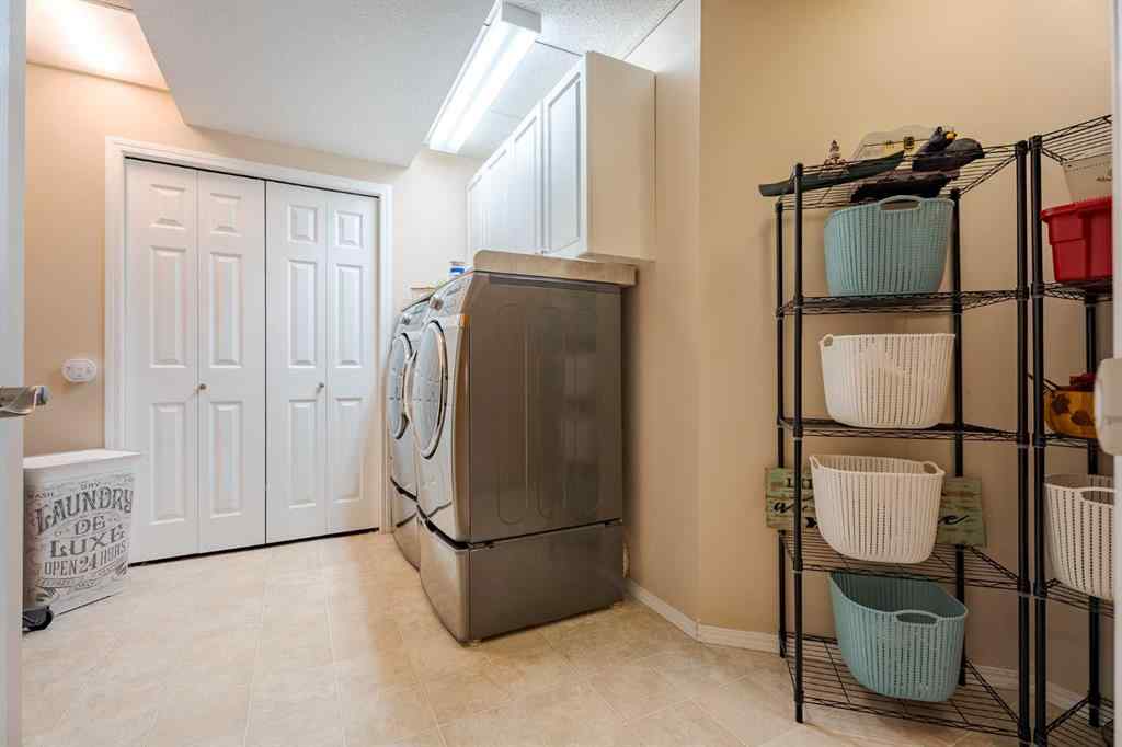 MLS® A2259009 - 100 Coopers Heights SW in Coopers Crossing Airdrie, Residential