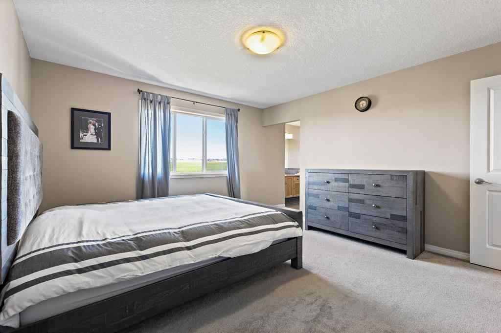 MLS® A2259228 - 114 Everglen Crescent SW in Evergreen Calgary, Residential