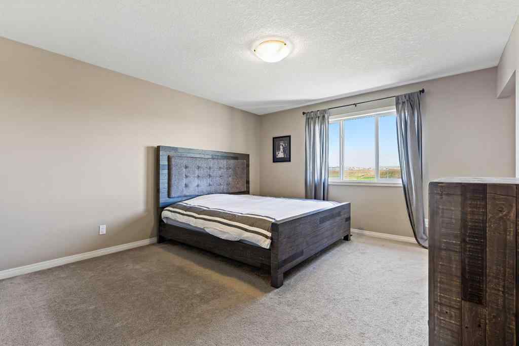 MLS® A2259228 - 114 Everglen Crescent SW in Evergreen Calgary, Residential