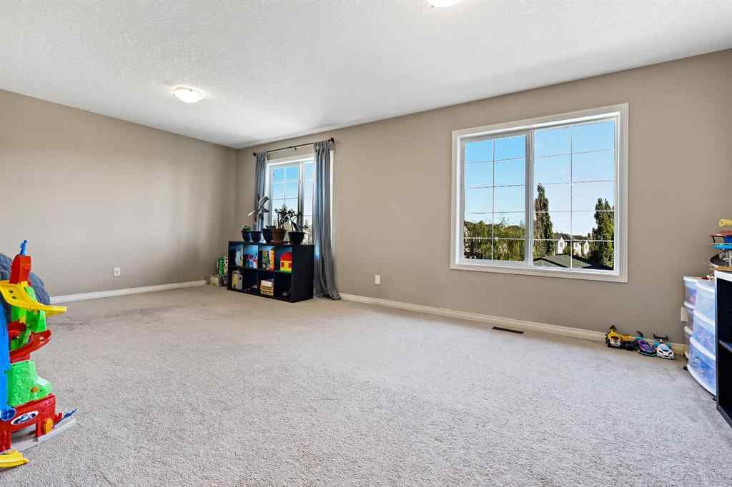 MLS® A2259228 - 114 Everglen Crescent SW in Evergreen Calgary, Residential