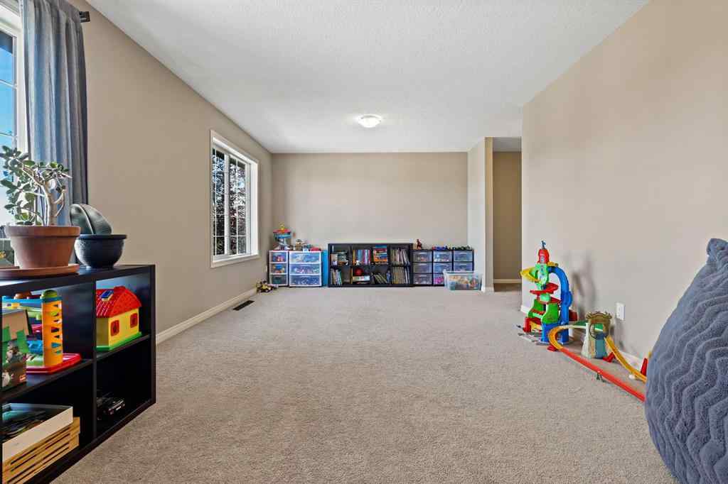 MLS® A2259228 - 114 Everglen Crescent SW in Evergreen Calgary, Residential