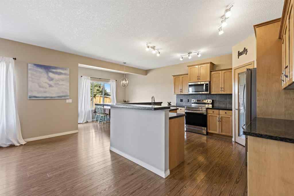 MLS® A2259228 - 114 Everglen Crescent SW in Evergreen Calgary, Residential