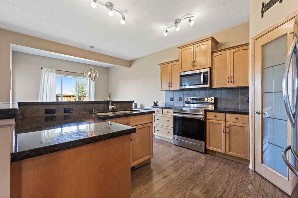 MLS® A2259228 - 114 Everglen Crescent SW in Evergreen Calgary, Residential