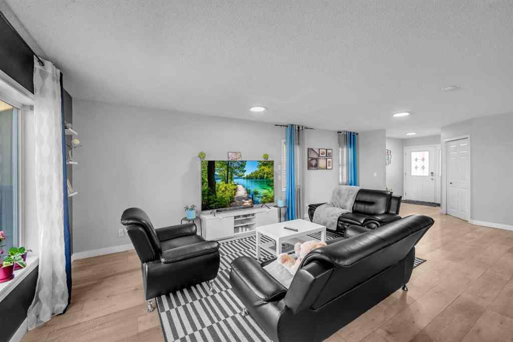 MLS® A2259387 - 233 Saddlecrest Way NE in Saddle Ridge Calgary, Residential