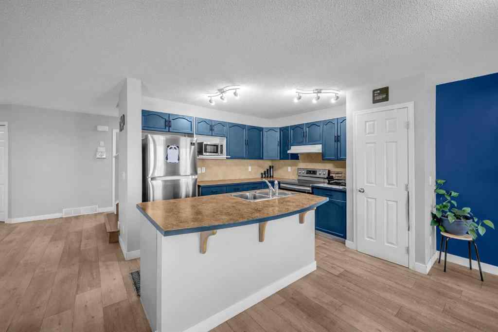 MLS® A2259387 - 233 Saddlecrest Way NE in Saddle Ridge Calgary, Residential