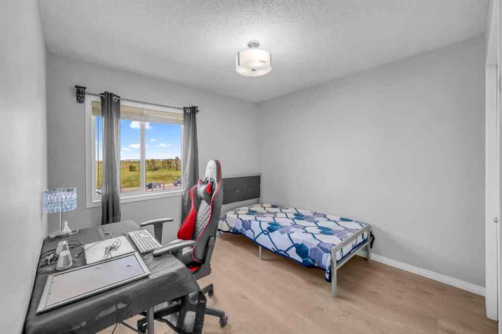 MLS® A2259387 - 233 Saddlecrest Way NE in Saddle Ridge Calgary, Residential