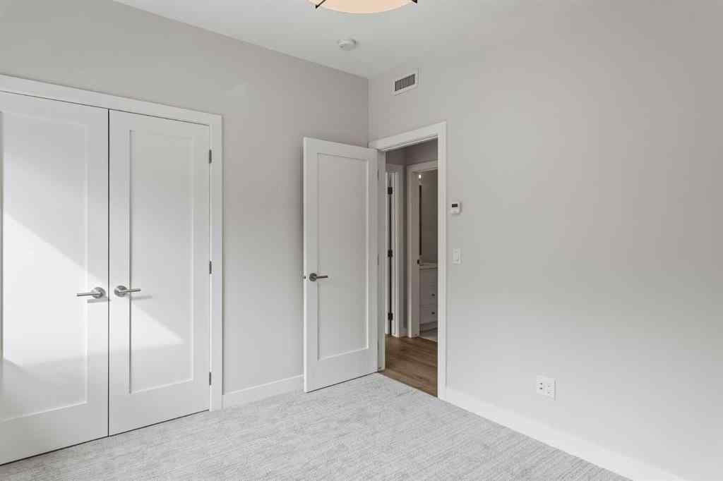 MLS® A2259828 - Unit #203J 209 Stewart Creek Rise  in Three Sisters Canmore, Residential