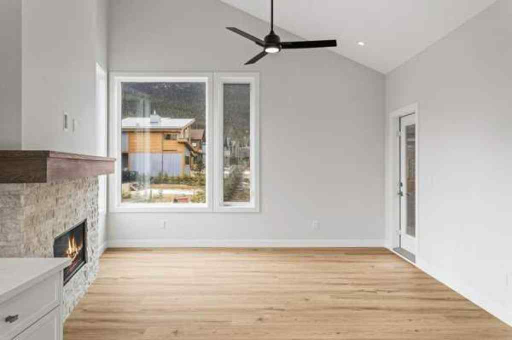 MLS® A2259828 - Unit #203J 209 Stewart Creek Rise  in Three Sisters Canmore, Residential