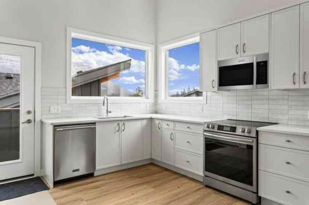 MLS® A2259828 - Unit #203J 209 Stewart Creek Rise  in Three Sisters Canmore, Residential