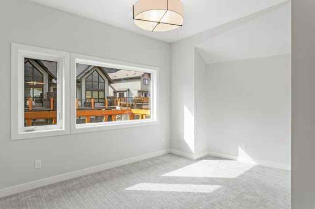 MLS® A2259828 - Unit #203J 209 Stewart Creek Rise  in Three Sisters Canmore, Residential