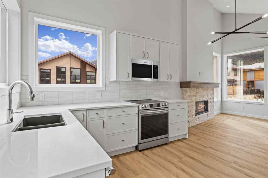 MLS® A2259828 - Unit #203J 209 Stewart Creek Rise  in Three Sisters Canmore, Residential