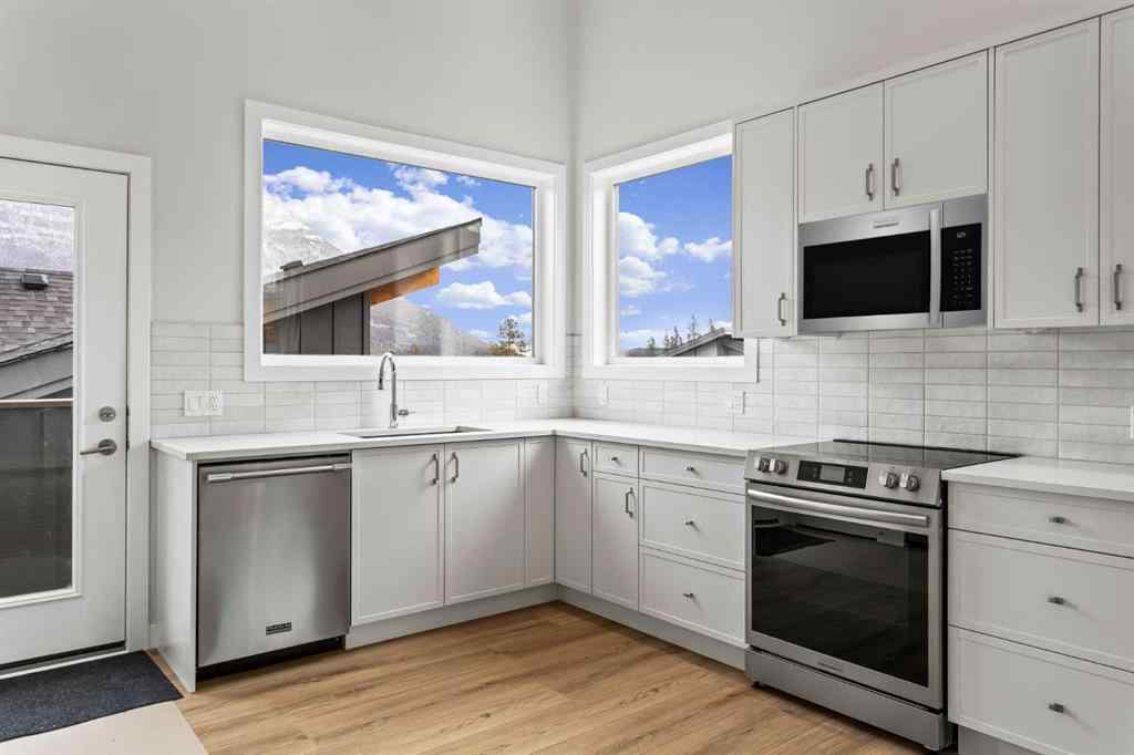 MLS® A2259828 - Unit #203J 209 Stewart Creek Rise  in Three Sisters Canmore, Residential