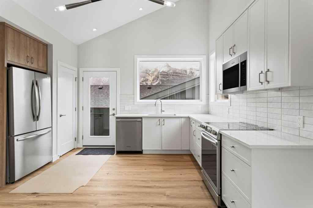 MLS® A2259828 - Unit #203J 209 Stewart Creek Rise  in Three Sisters Canmore, Residential