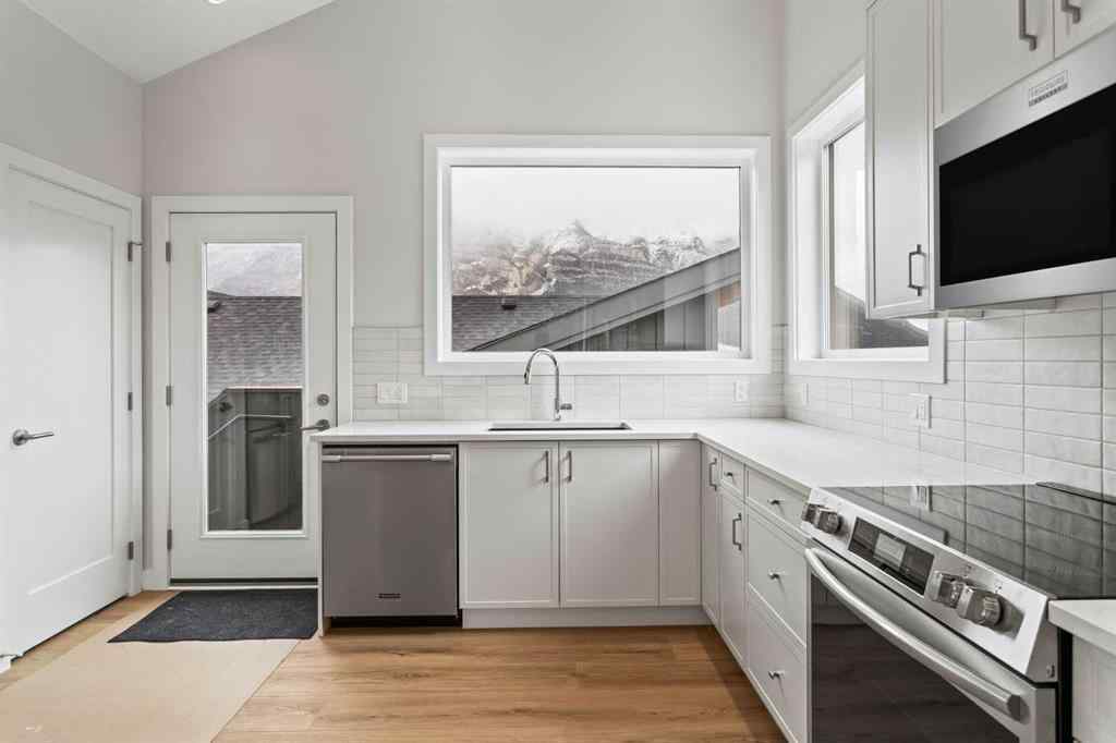 MLS® A2259828 - Unit #203J 209 Stewart Creek Rise  in Three Sisters Canmore, Residential