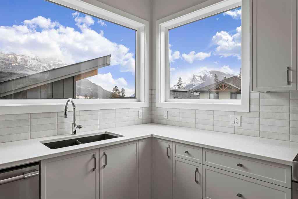 MLS® A2259828 - Unit #203J 209 Stewart Creek Rise  in Three Sisters Canmore, Residential