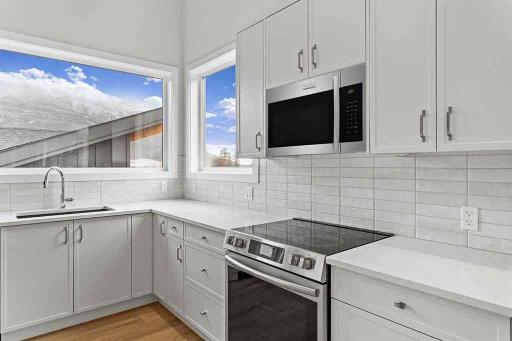 MLS® A2259828 - Unit #203J 209 Stewart Creek Rise  in Three Sisters Canmore, Residential