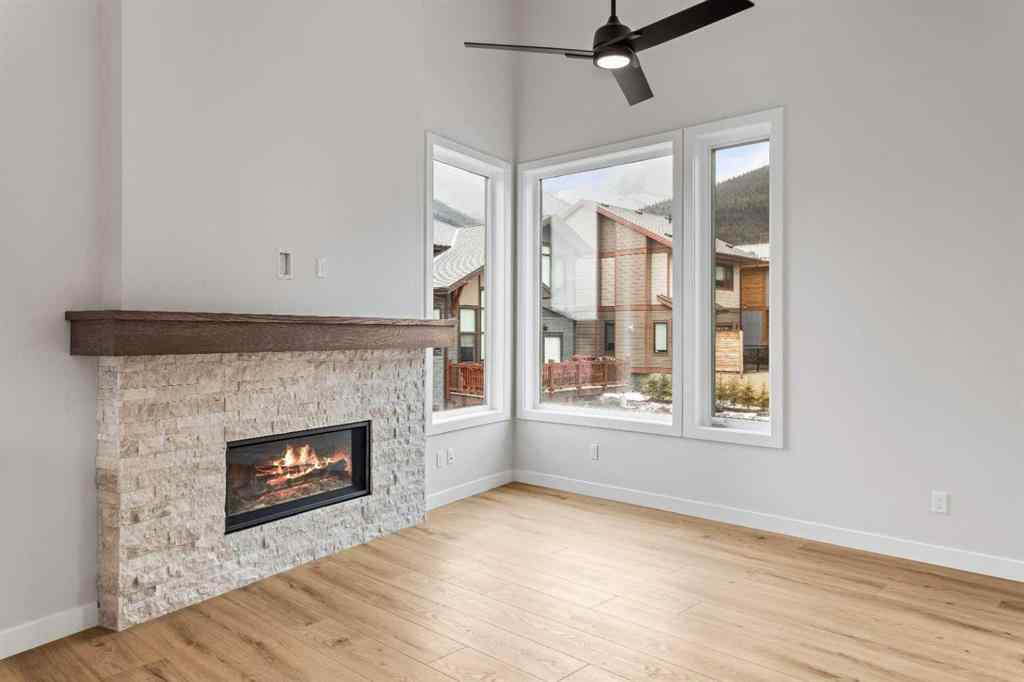 MLS® A2259828 - Unit #203J 209 Stewart Creek Rise  in Three Sisters Canmore, Residential