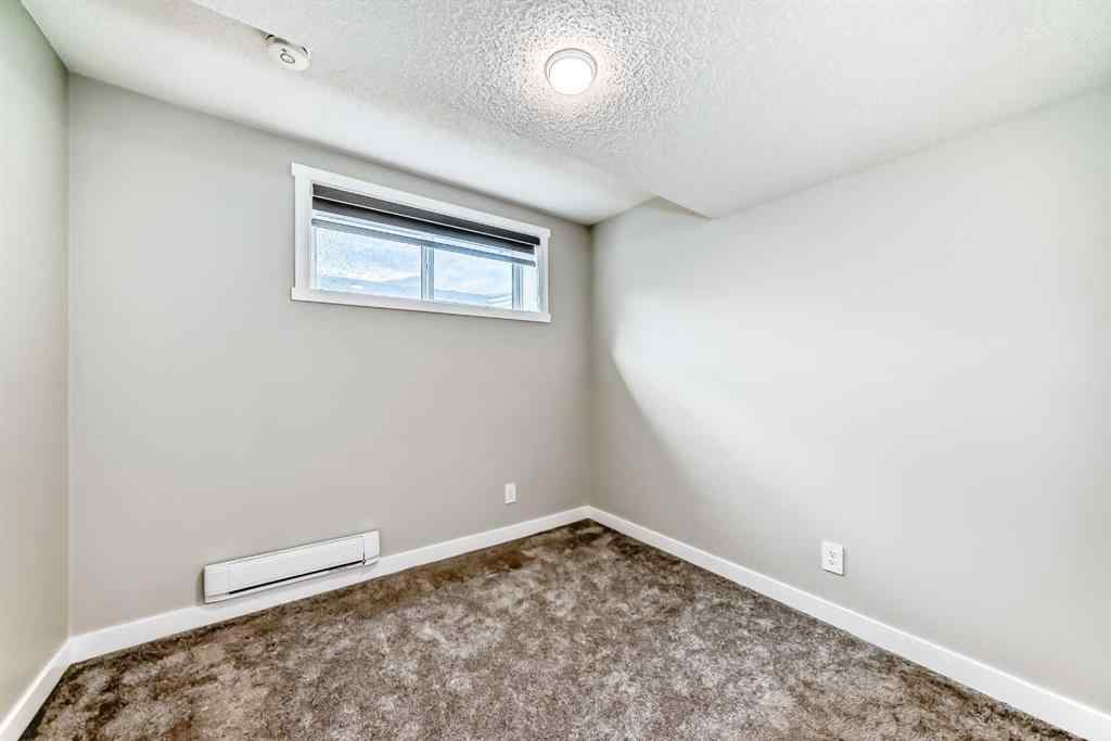 MLS® A2259951 - 157 Belmont Drive SW in Belmont Calgary, Residential