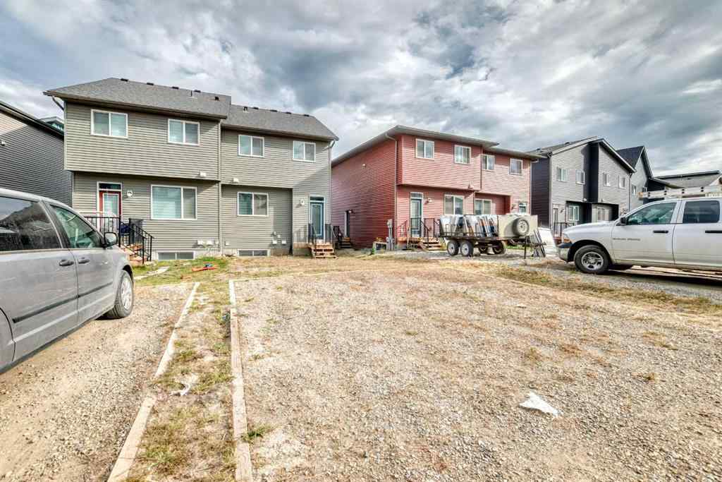 MLS® A2259951 - 157 Belmont Drive SW in Belmont Calgary, Residential