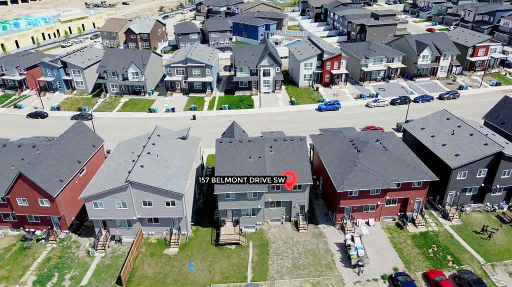 MLS® A2259951 - 157 Belmont Drive SW in Belmont Calgary, Residential
