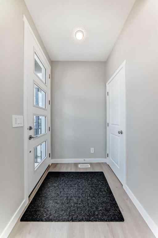 MLS® A2259951 - 157 Belmont Drive SW in Belmont Calgary, Residential