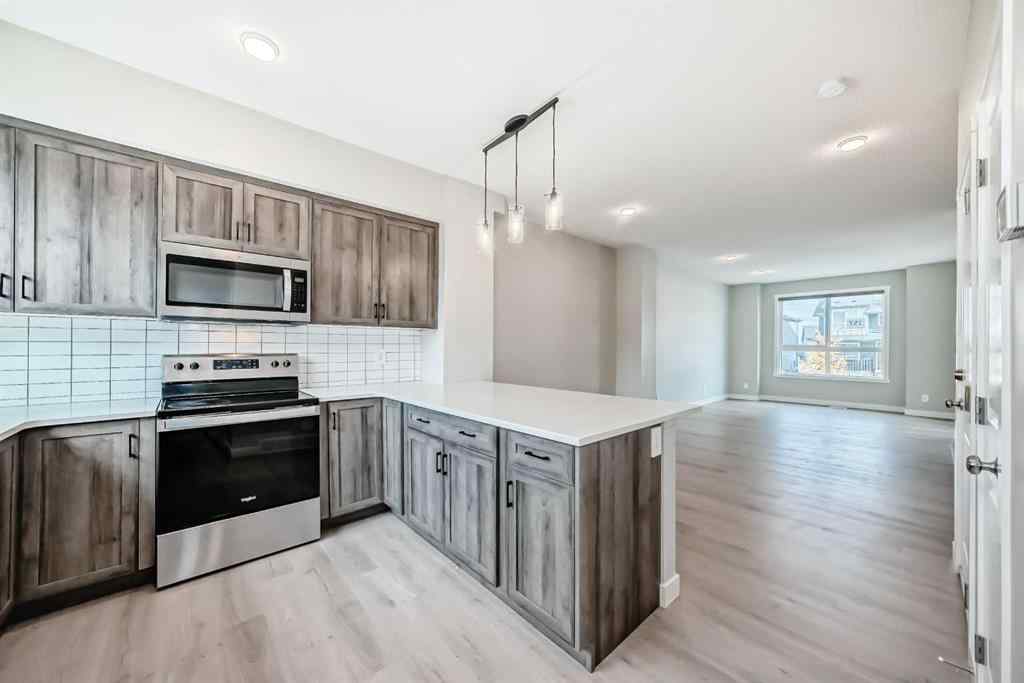 MLS® A2259951 - 157 Belmont Drive SW in Belmont Calgary, Residential