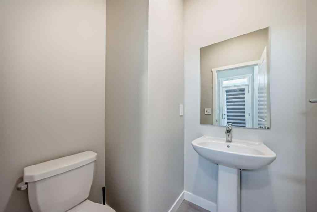 MLS® A2259951 - 157 Belmont Drive SW in Belmont Calgary, Residential