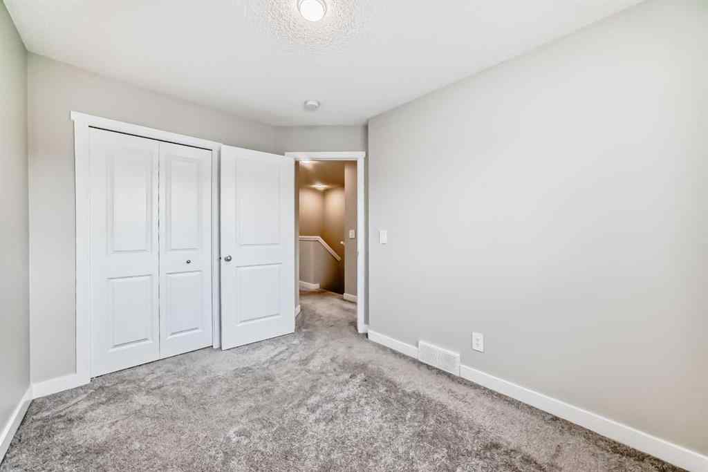 MLS® A2259951 - 157 Belmont Drive SW in Belmont Calgary, Residential