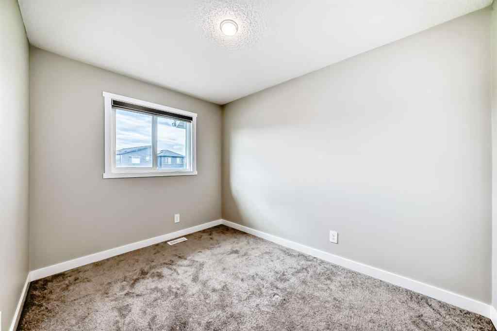 MLS® A2259951 - 157 Belmont Drive SW in Belmont Calgary, Residential