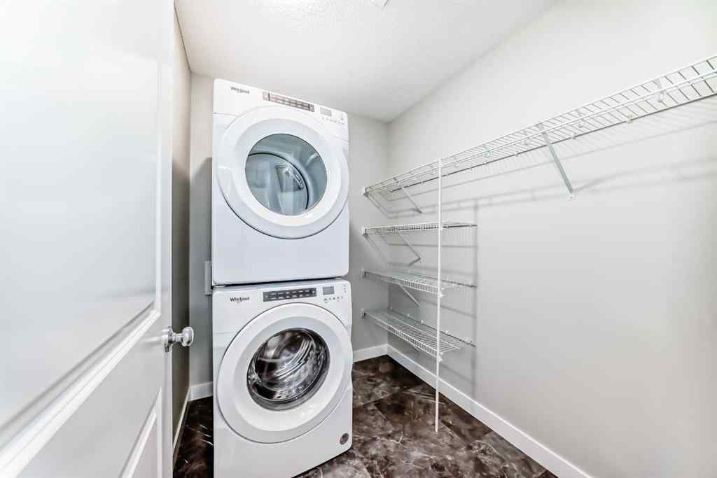 MLS® A2259951 - 157 Belmont Drive SW in Belmont Calgary, Residential