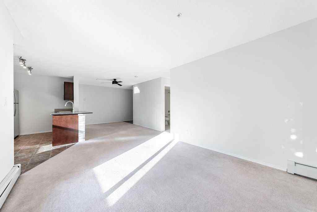 MLS® A2259958 - Unit #9113 403 Mackenzie Way SW in Downtown Airdrie, Residential