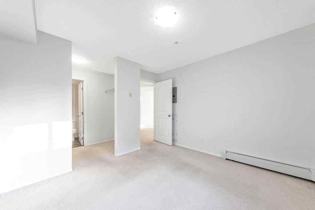 MLS® A2259958 - Unit #9113 403 Mackenzie Way SW in Downtown Airdrie, Residential