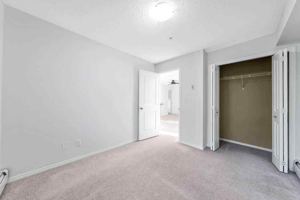 MLS® A2259958 - Unit #9113 403 Mackenzie Way SW in Downtown Airdrie, Residential