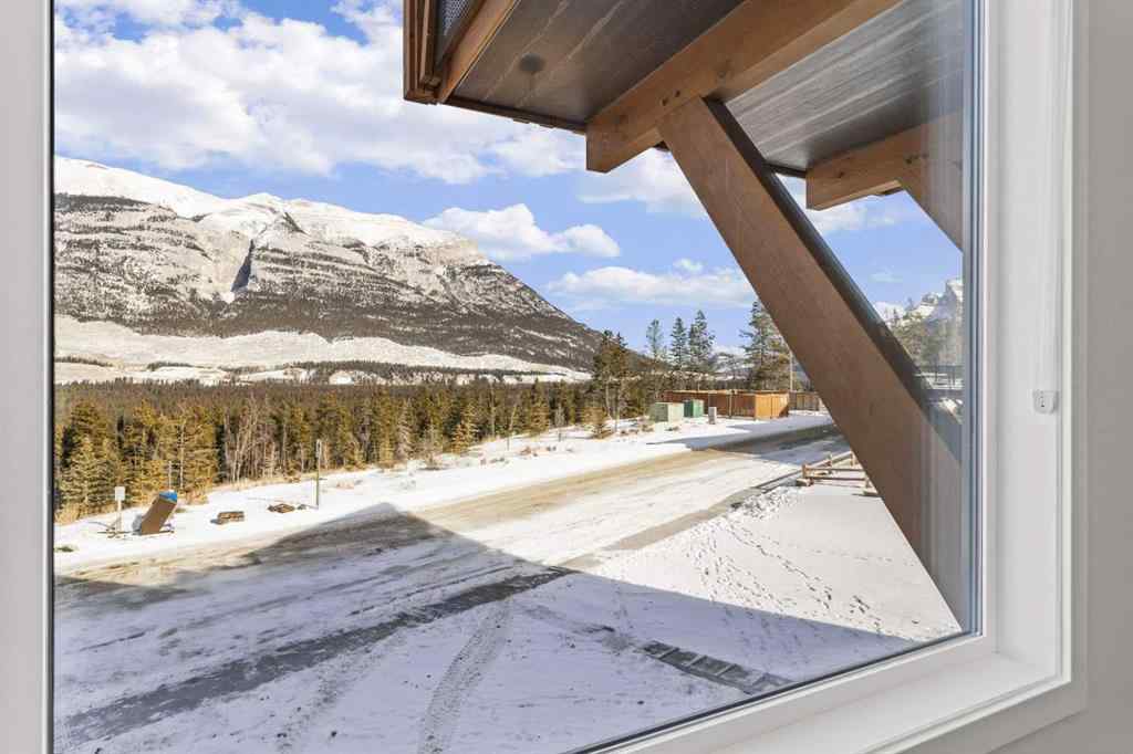 MLS® A2260034 - Unit #201J 209 Stewart Creek Rise  in Three Sisters Canmore, Residential