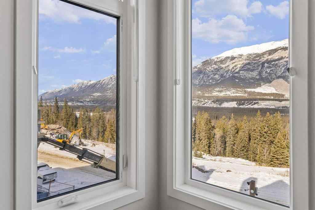 MLS® A2260034 - Unit #201J 209 Stewart Creek Rise  in Three Sisters Canmore, Residential