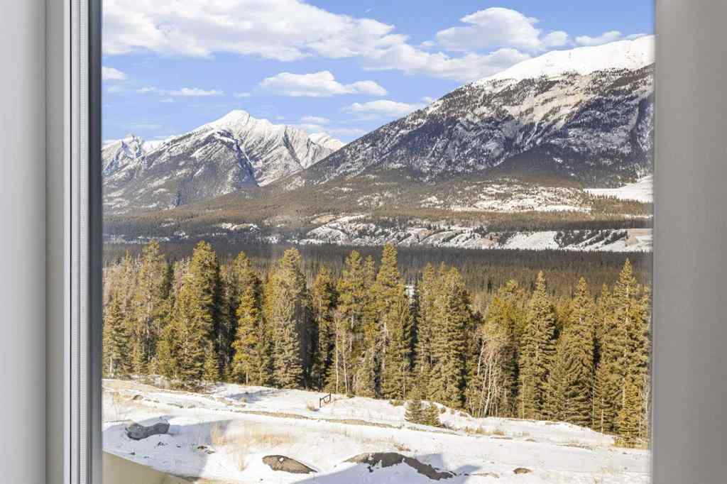 MLS® A2260034 - Unit #201J 209 Stewart Creek Rise  in Three Sisters Canmore, Residential