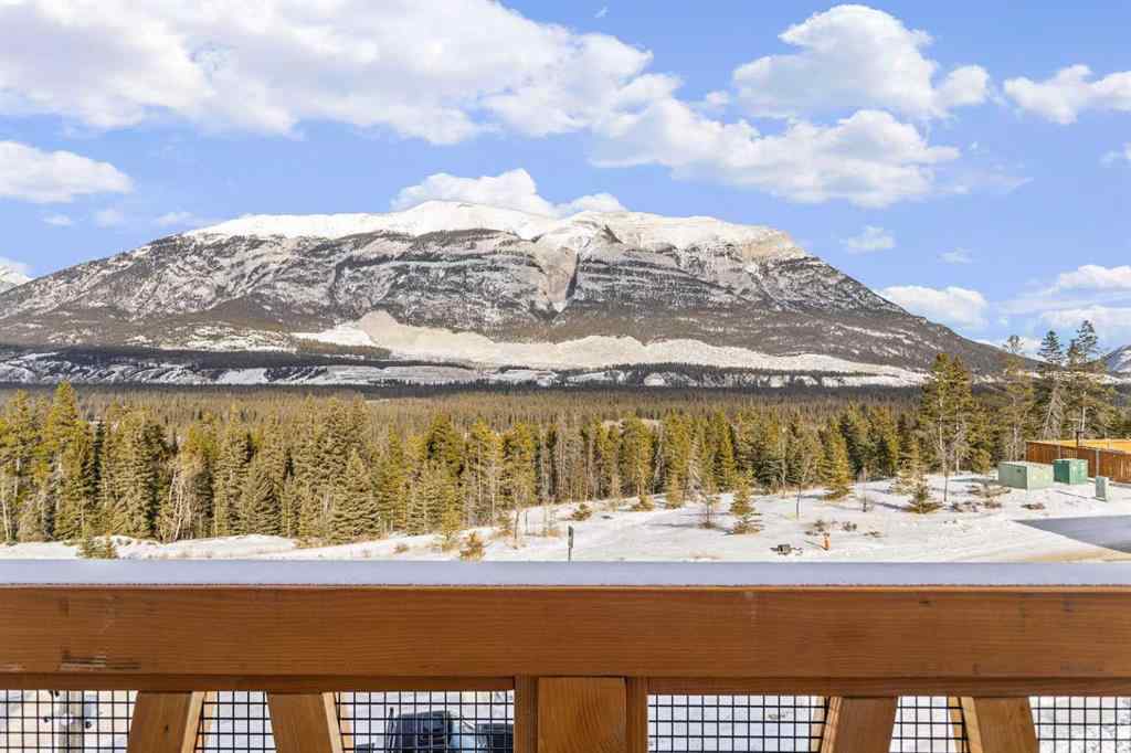 MLS® A2260034 - Unit #201J 209 Stewart Creek Rise  in Three Sisters Canmore, Residential