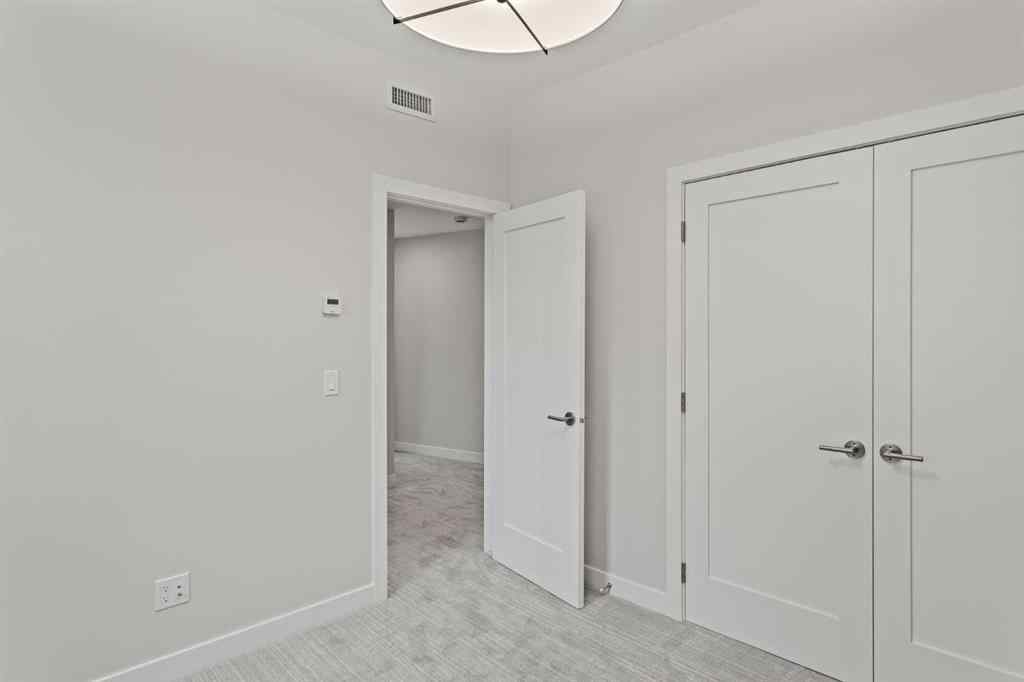 MLS® A2260034 - Unit #201J 209 Stewart Creek Rise  in Three Sisters Canmore, Residential