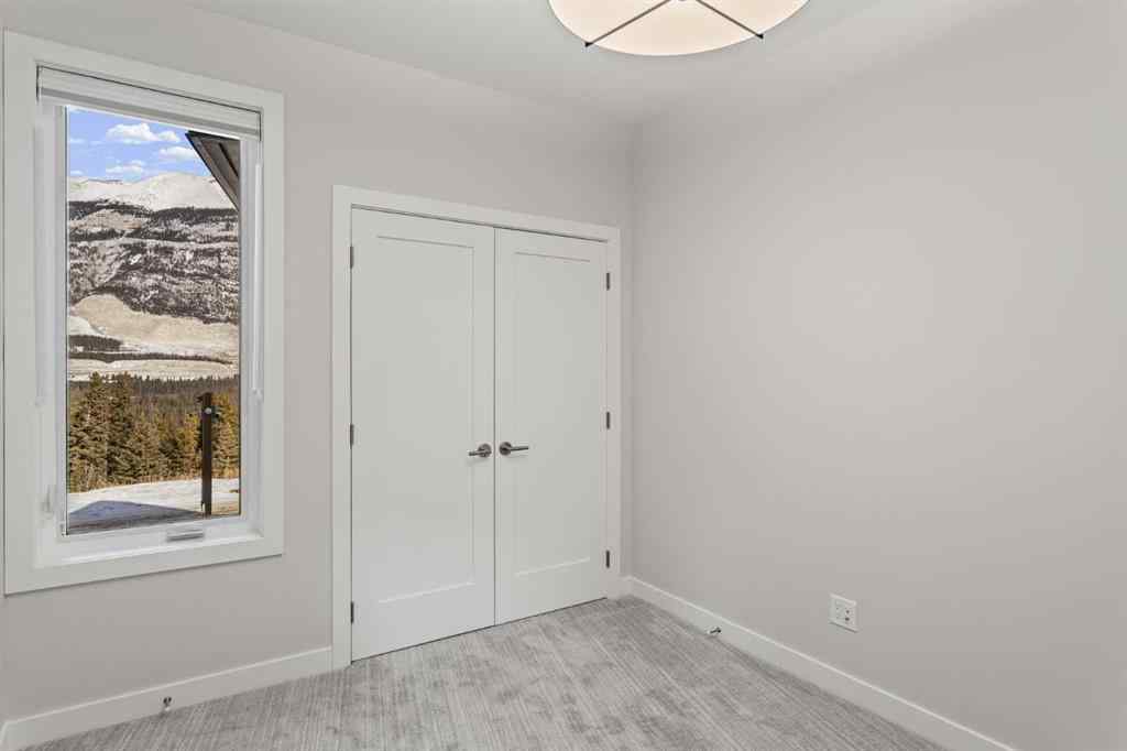 MLS® A2260034 - Unit #201J 209 Stewart Creek Rise  in Three Sisters Canmore, Residential