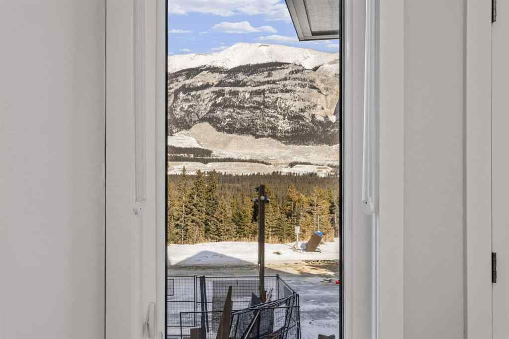 MLS® A2260034 - Unit #201J 209 Stewart Creek Rise  in Three Sisters Canmore, Residential