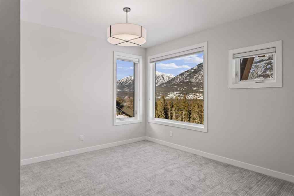 MLS® A2260034 - Unit #201J 209 Stewart Creek Rise  in Three Sisters Canmore, Residential