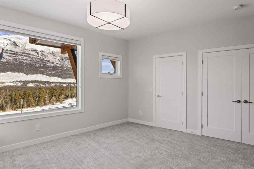 MLS® A2260034 - Unit #201J 209 Stewart Creek Rise  in Three Sisters Canmore, Residential