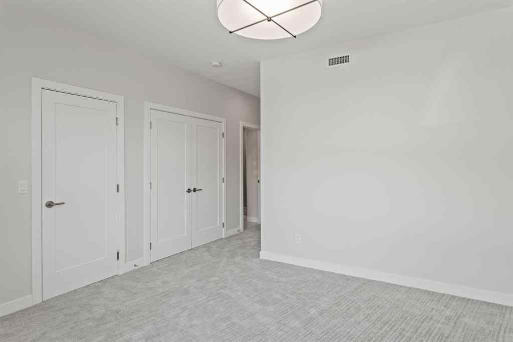 MLS® A2260034 - Unit #201J 209 Stewart Creek Rise  in Three Sisters Canmore, Residential