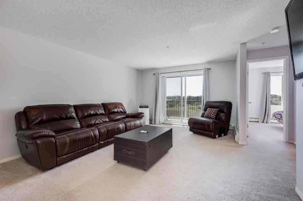MLS® A2260044 - Unit #7308 304 Mackenzie Way SW in Downtown Airdrie, Residential