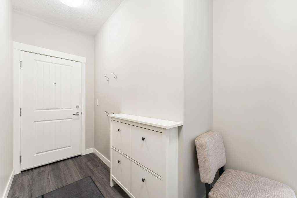 MLS® A2260059 - Unit #104 110 Auburn Meadows View SE in Auburn Bay Calgary, Residential